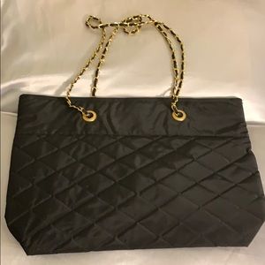 A black and gold tote bag.